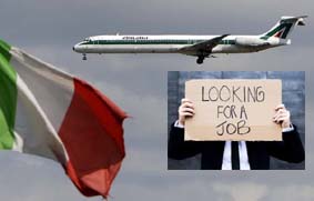 File photo of an Alitalia plane approaching to land as an Italian flag is seen at Fiumicino international airport in Rome
